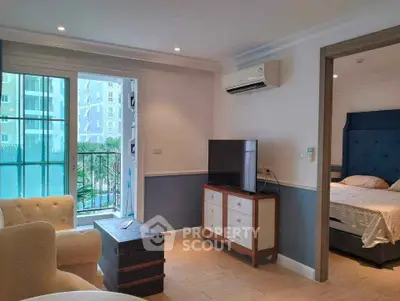 Charming living room with pool view and cozy bedroom in modern apartment