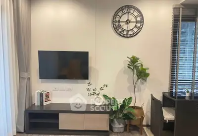 Modern living room with wall-mounted TV and stylish decor