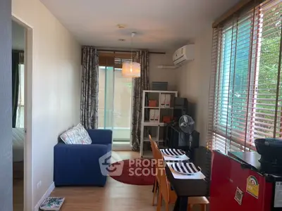 Charming living room with modern decor and natural light in cozy apartment.