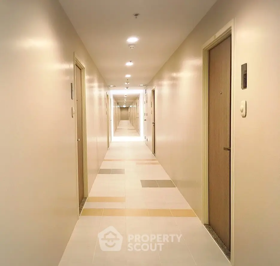 Modern apartment hallway with bright lighting and sleek design