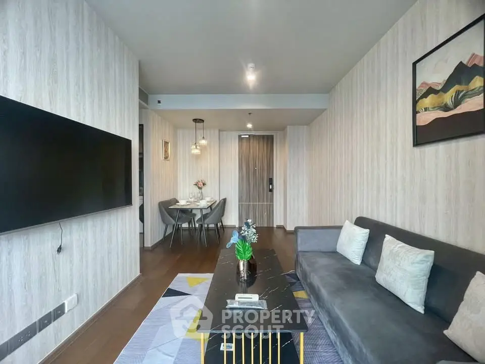 Modern living room with stylish decor and wall-mounted TV
