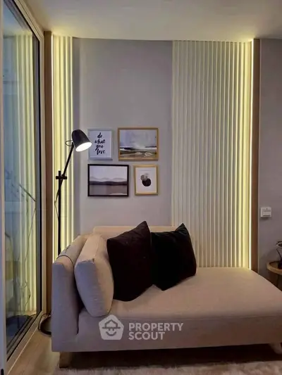 Stylish modern living room with cozy sofa and ambient lighting, perfect for relaxation and comfort.