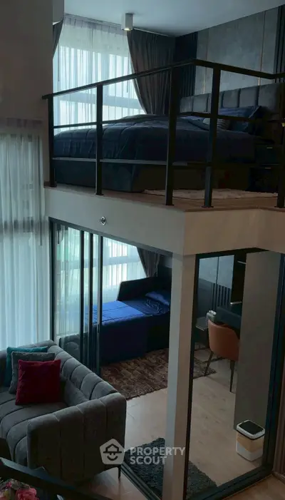 Modern loft apartment with mezzanine bedroom and stylish living area, featuring floor-to-ceiling windows.