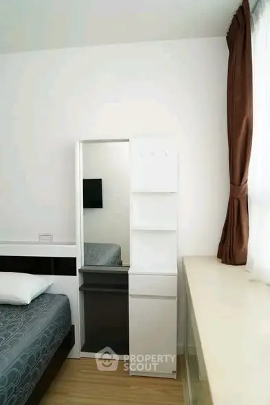 Modern bedroom with sleek furniture and natural light