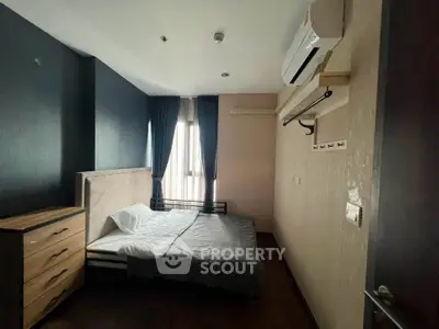 Cozy bedroom with modern air conditioning and natural light