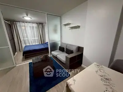 Modern studio apartment with cozy living area and bedroom separation