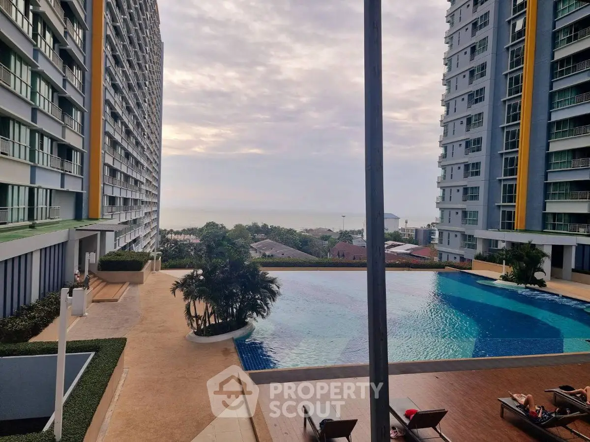 Luxurious high-rise apartment complex with stunning pool and ocean view