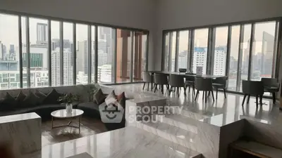 Luxurious high-rise living room with panoramic city views and elegant marble flooring.