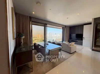 Luxurious living room with stunning city view, modern furniture, and elegant decor in high-rise apartment.