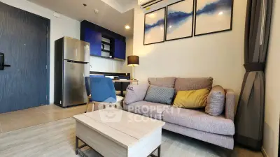 Modern living room with stylish decor and open layout, featuring a cozy sofa and sleek furniture.