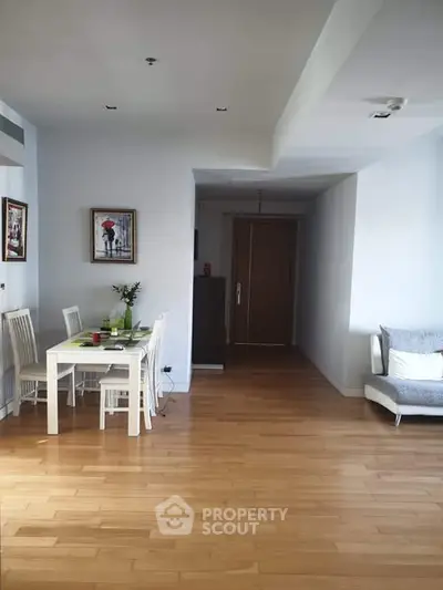 Spacious living area with wooden flooring and modern decor