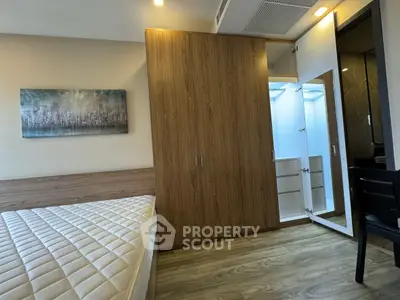 Modern bedroom with wooden wardrobe and stylish decor