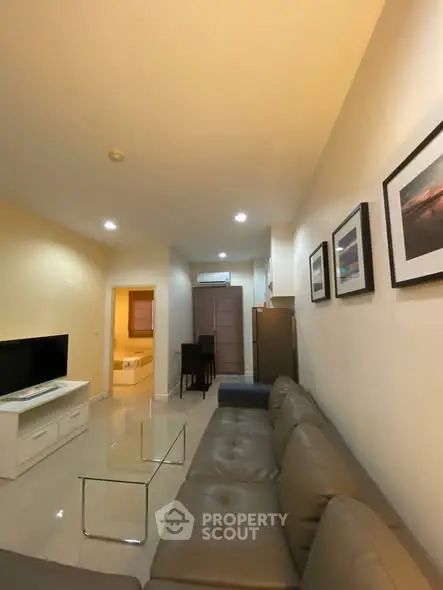 Spacious living room with modern decor and comfortable seating