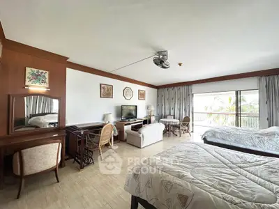 Spacious bedroom with elegant decor and balcony view