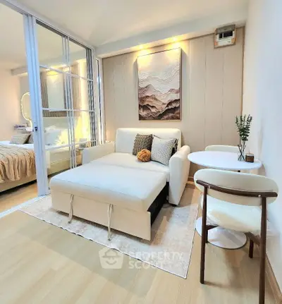 Modern living room with stylish decor and cozy seating in a contemporary apartment.