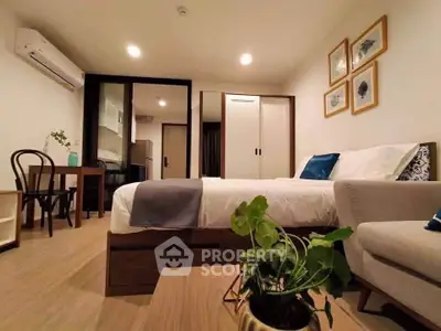 Modern bedroom with cozy decor and stylish furniture in a contemporary apartment.