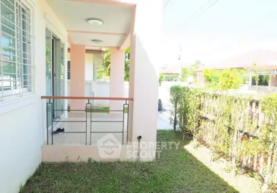 Charming small balcony with garden view in a cozy residential area.