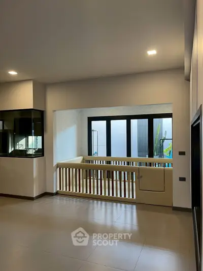 Spacious modern living area with large windows and sleek design