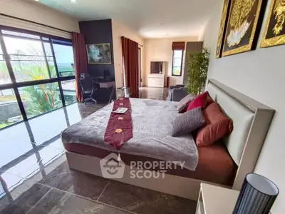Luxurious bedroom with modern decor and large windows offering stunning views