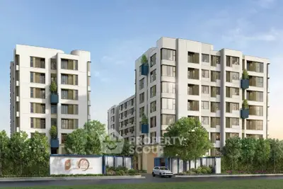 Modern apartment buildings with lush greenery and clear blue sky, showcasing contemporary urban living.