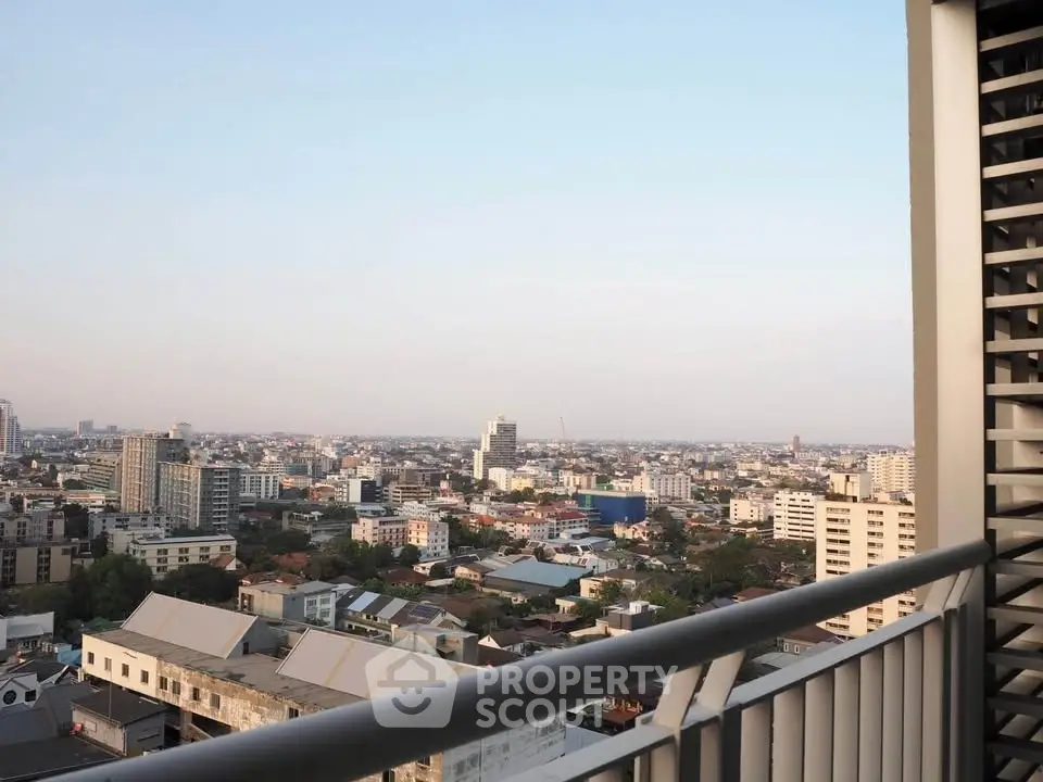 Stunning cityscape view from a high-rise balcony, showcasing urban skyline and expansive horizon.