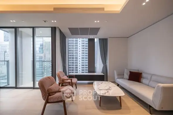 Modern living room with city view, elegant furniture, and floor-to-ceiling windows.