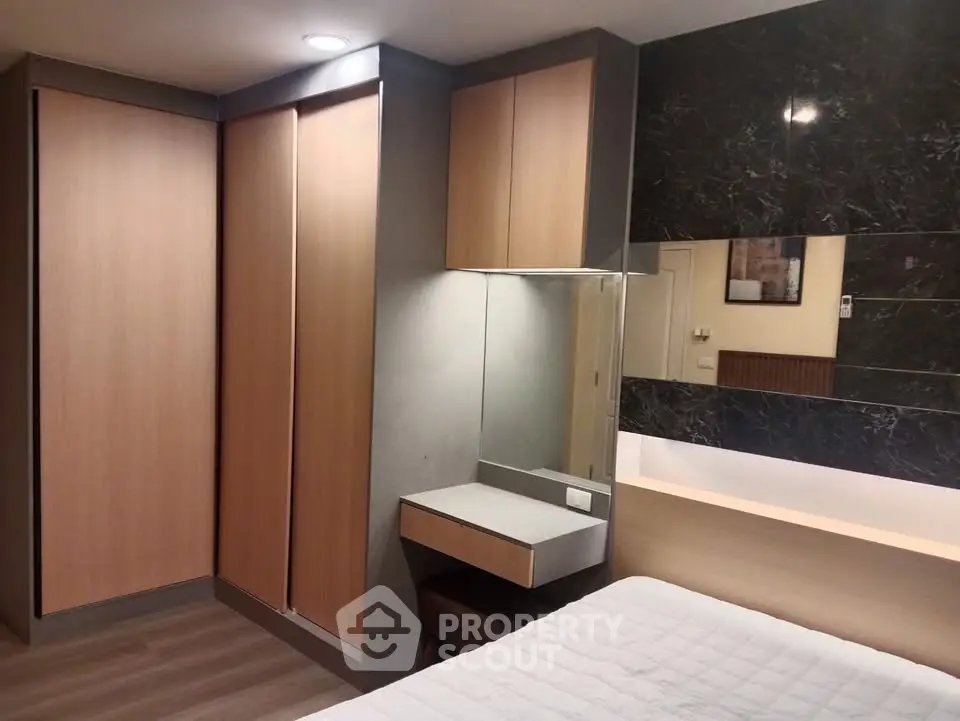 Modern bedroom with sleek built-in wardrobe and stylish decor