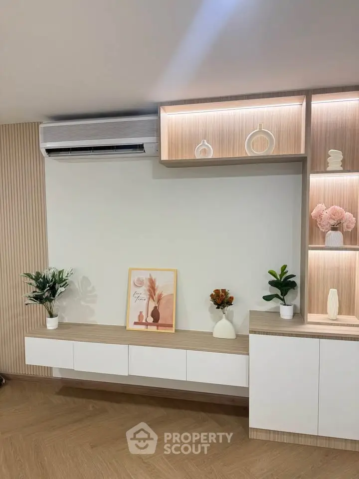 Modern living room with stylish decor and built-in shelving