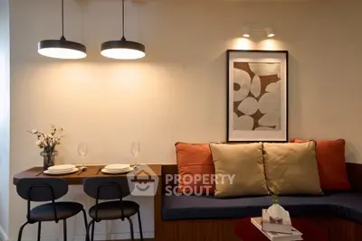 Stylish modern living room with cozy seating and elegant dining area, perfect for urban living.