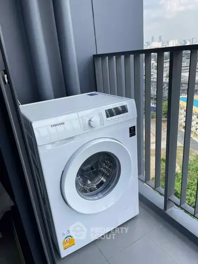 Modern balcony with Samsung washing machine and city view, perfect for urban living convenience.