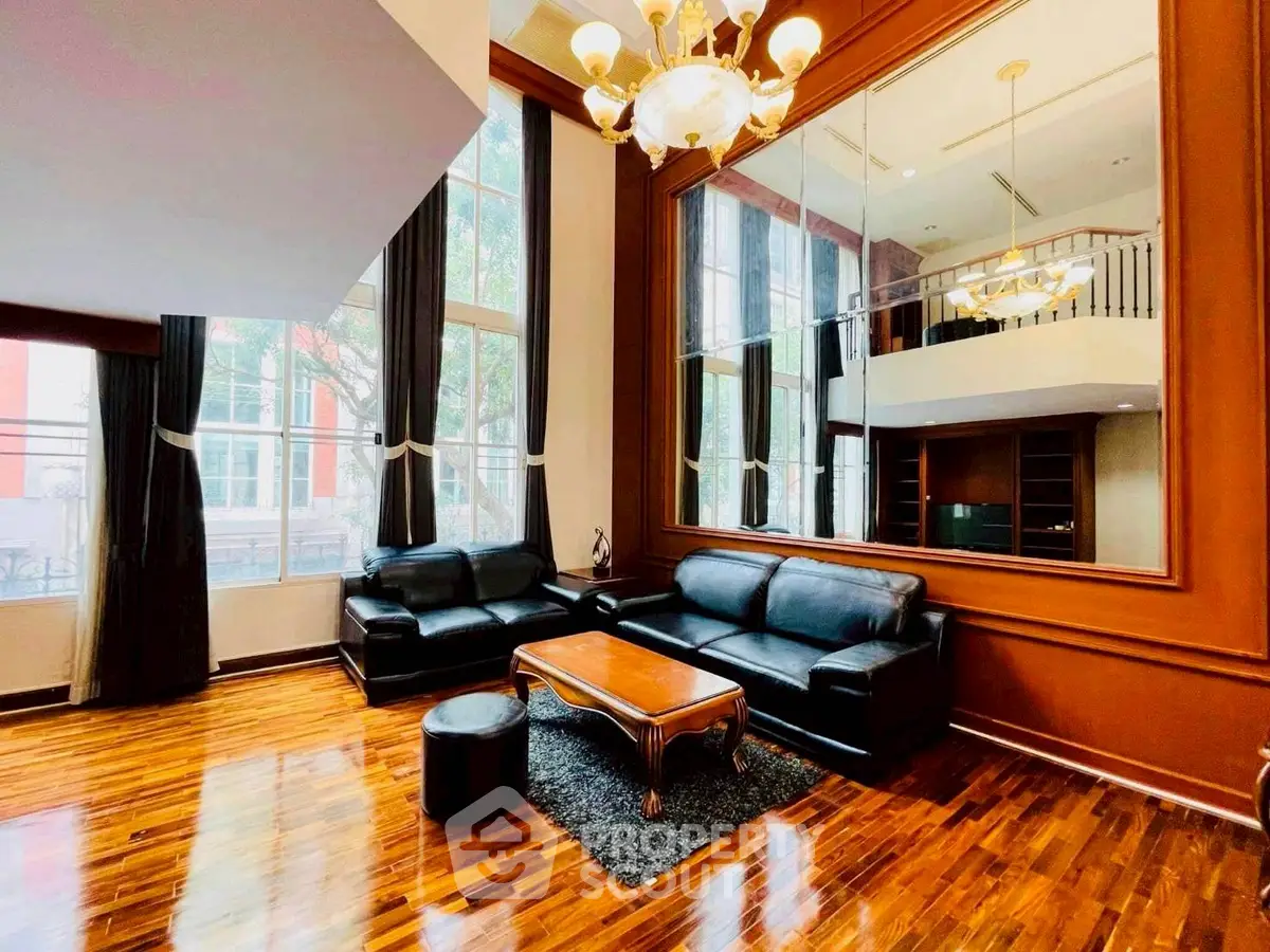 Luxurious living room with high ceilings and elegant decor