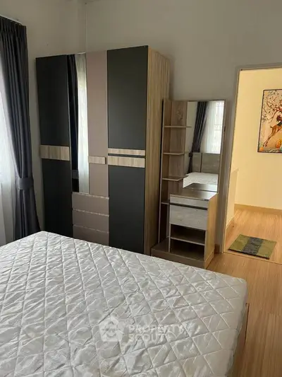 Modern bedroom with stylish wardrobe and natural light