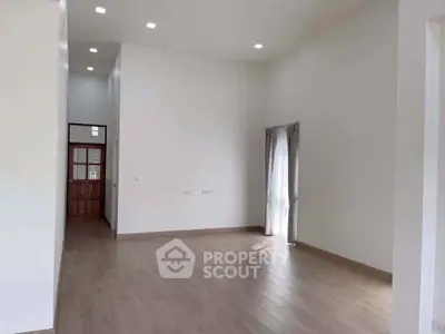 Spacious modern living room with high ceilings and natural light