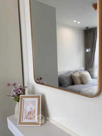 Elegant bedroom with stylish mirror and cozy decor