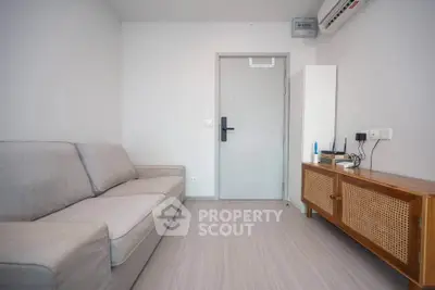 Modern minimalist living room with sleek furniture and neutral tones