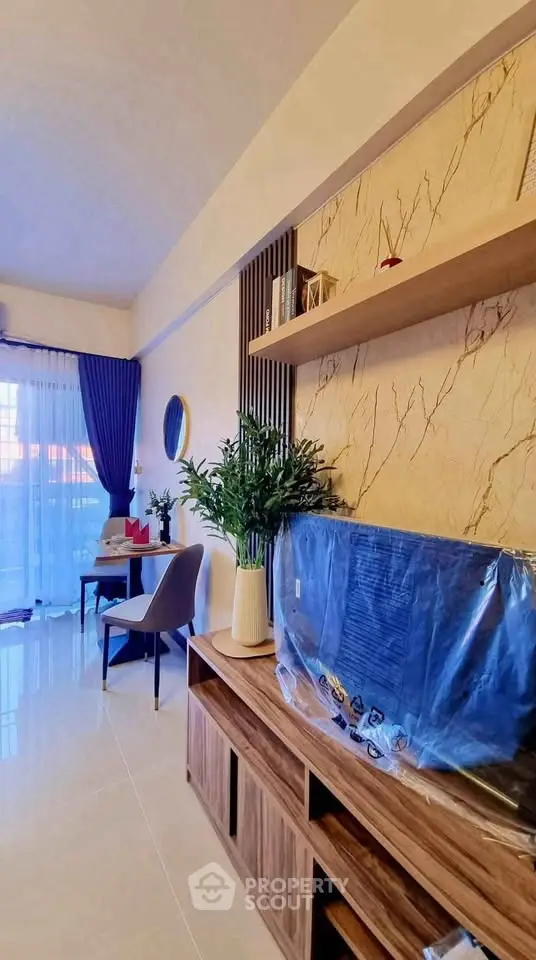 Stylish living room with modern decor and natural light, featuring elegant furniture and a cozy ambiance.