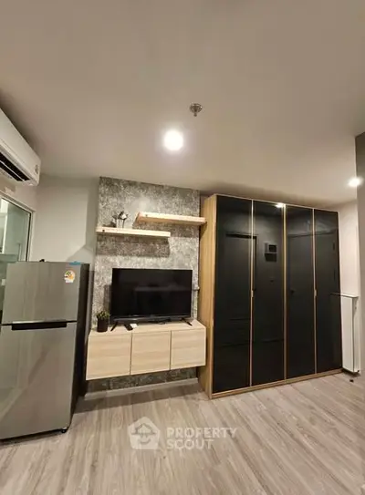 Modern living room with sleek TV unit and stylish wardrobe