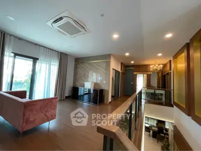 Spacious modern living room with elegant decor and large windows for natural light.