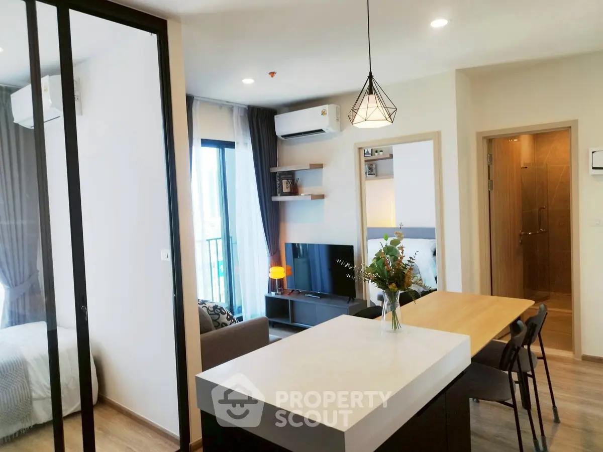 Modern open-plan living room with stylish decor and natural light