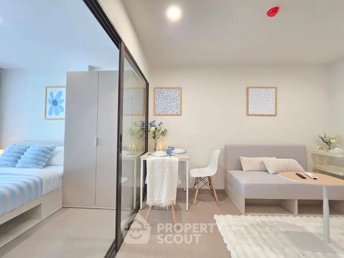 Modern studio apartment with cozy living area and stylish decor