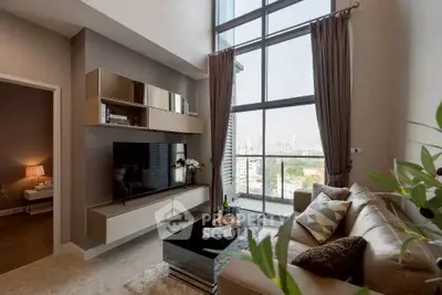 Luxurious living room with floor-to-ceiling windows and modern decor