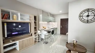 Modern open-plan living room with sleek kitchen and stylish decor