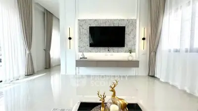 Luxurious modern living room with elegant decor and large TV setup