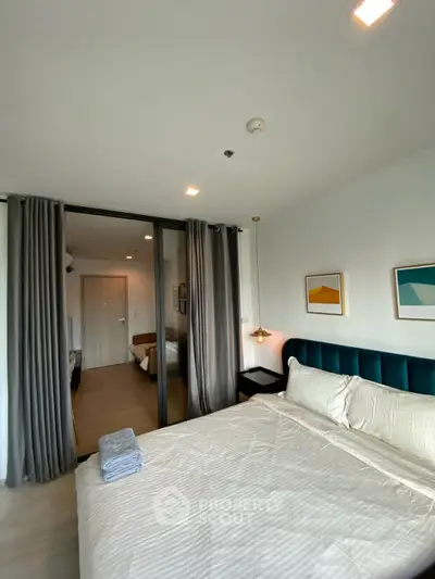 Modern bedroom with elegant decor and cozy ambiance in a stylish apartment