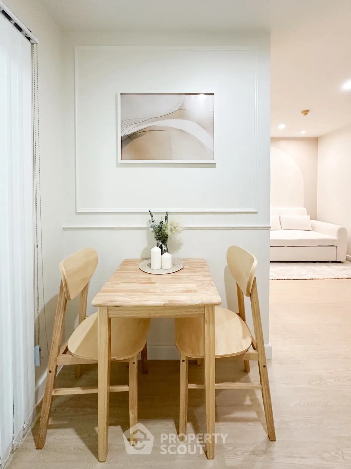 Cozy dining nook with wooden table and chairs in modern apartment