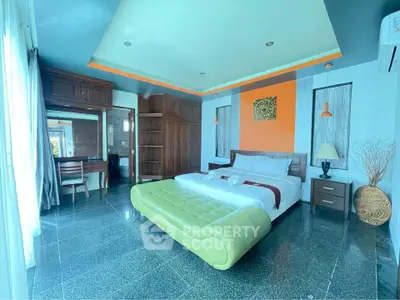 Luxurious bedroom with modern decor and ample natural light