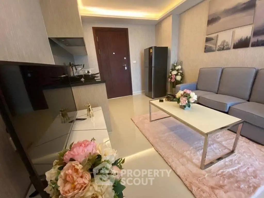 Modern living room with elegant decor and sleek furniture, featuring a cozy seating area and stylish accents.
