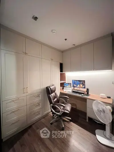 Modern study room with built-in cabinets and ergonomic chair