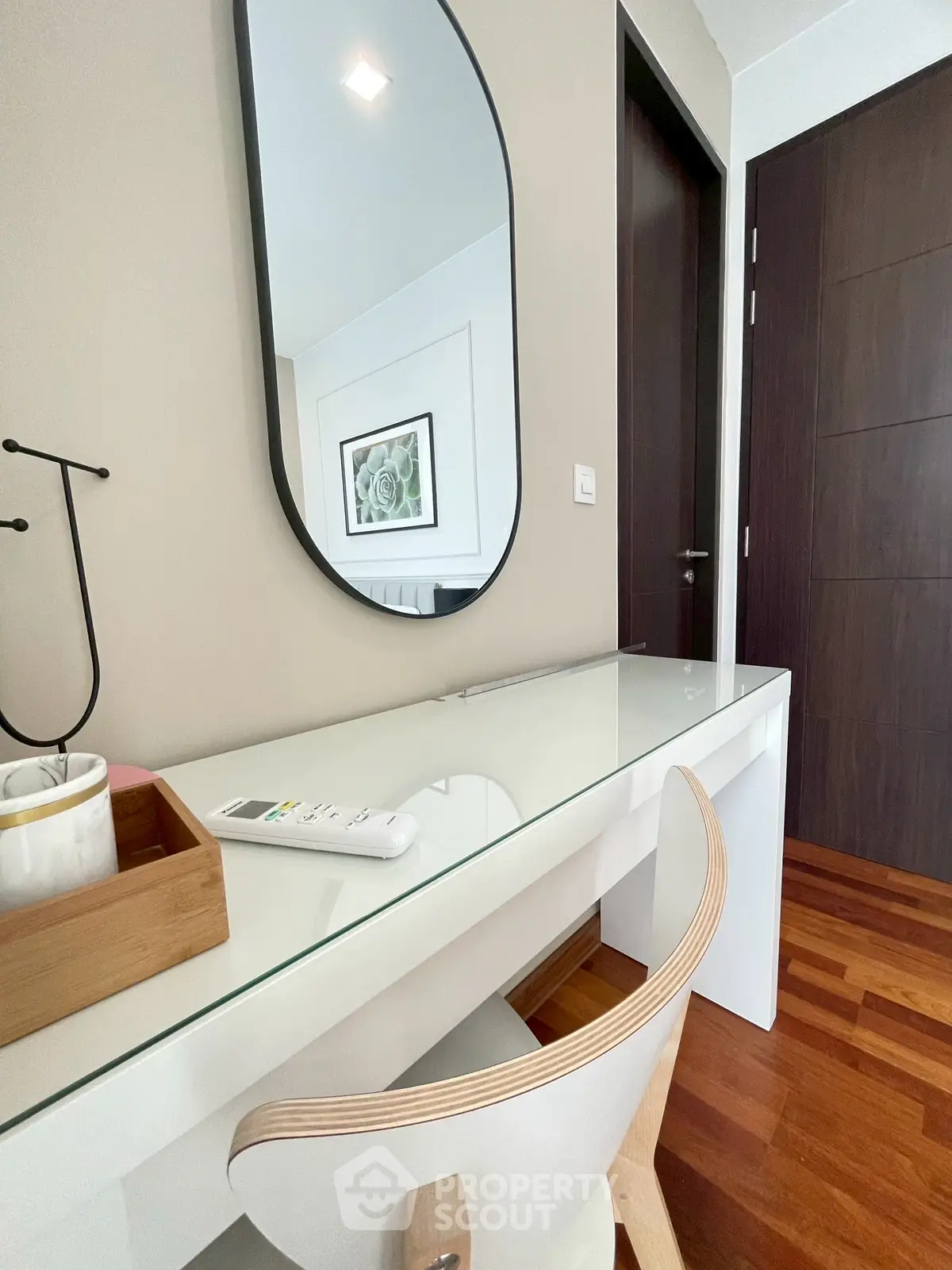 Modern study area with sleek desk and stylish chair in contemporary home.