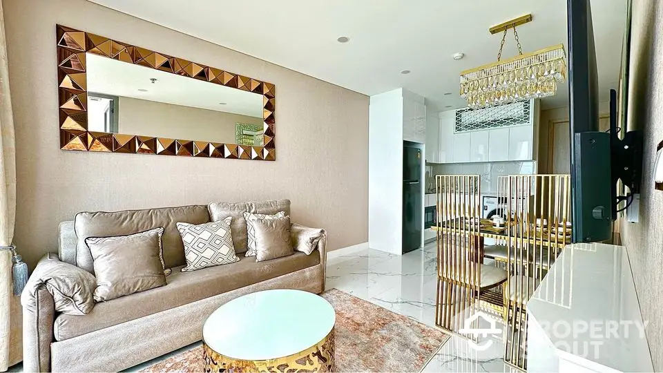 Luxurious living room with elegant decor and modern kitchen in open layout apartment